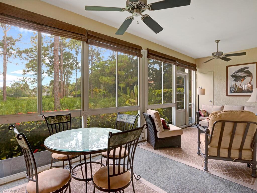 352 Bay Forest Drive, Unit 103 Naples, FL 34110 - Photo 1 of 30 a view of a dining room with furniture window and outside view