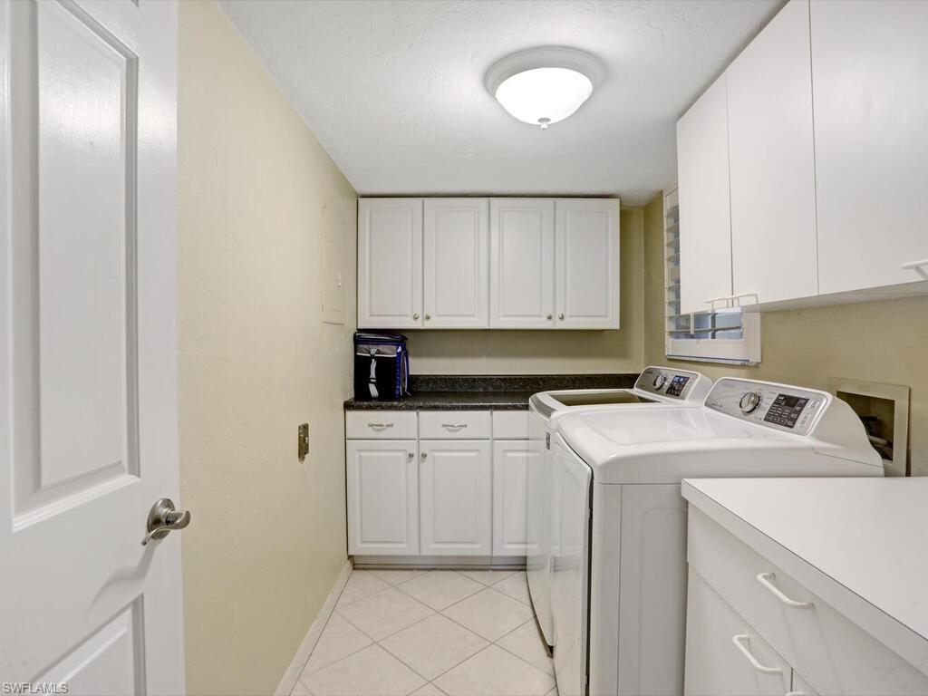 352 Bay Forest Drive, Unit 103 Naples, FL 34110 - Photo 25 of 30 a utility room with dryer and washer