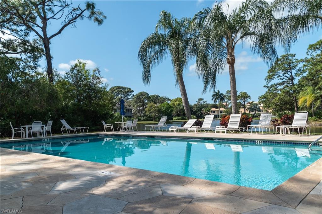 352 Bay Forest Drive, Unit 103 Naples, FL 34110 - Photo 28 of 30 a view of a backyard with a swimming pool
