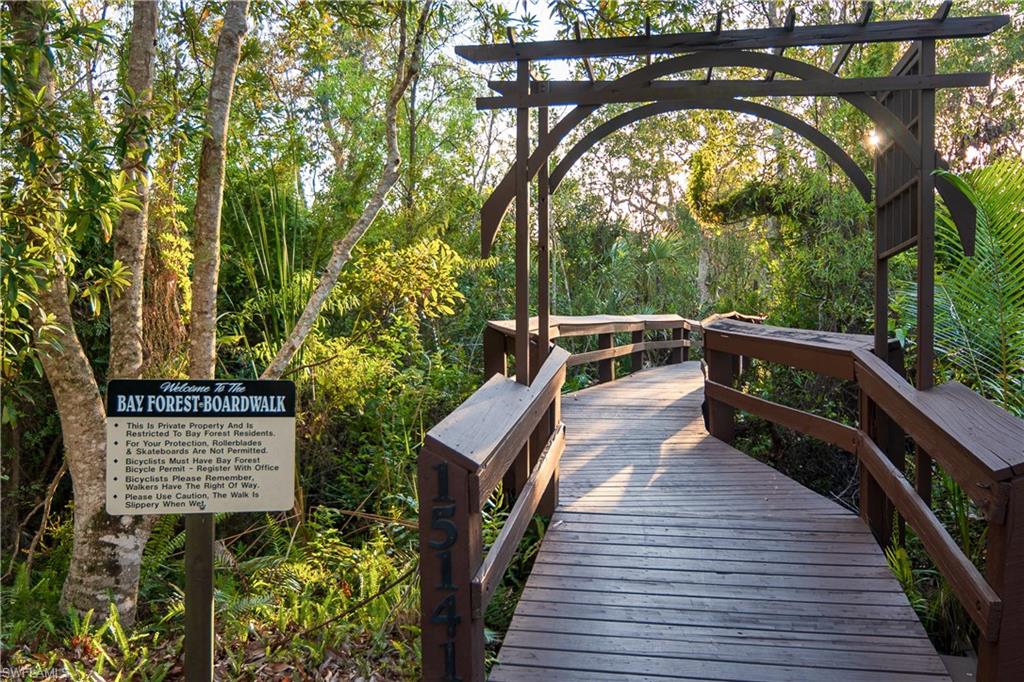 352 Bay Forest Drive, Unit 103 Naples, FL 34110 - Photo 29 of 30 a view of balcony with wooden floor and outdoor space