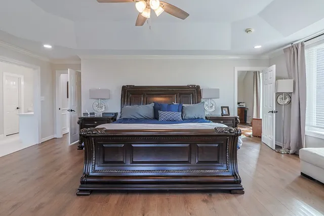 a living room with wooden floor and furniture
