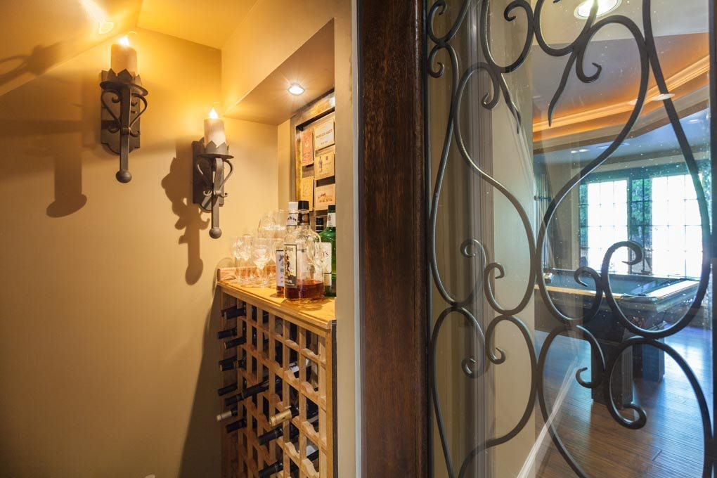12340 Canolder Street Raleigh, NC 27614 - Photo 27 of 30 Glass door with wrought iron adds a dose of charm Charming Wine Storage Closet