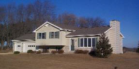 10730 West Edgewood Road Polo, IL 61064 - Photo 1 of 5 a front view of a house with a garden