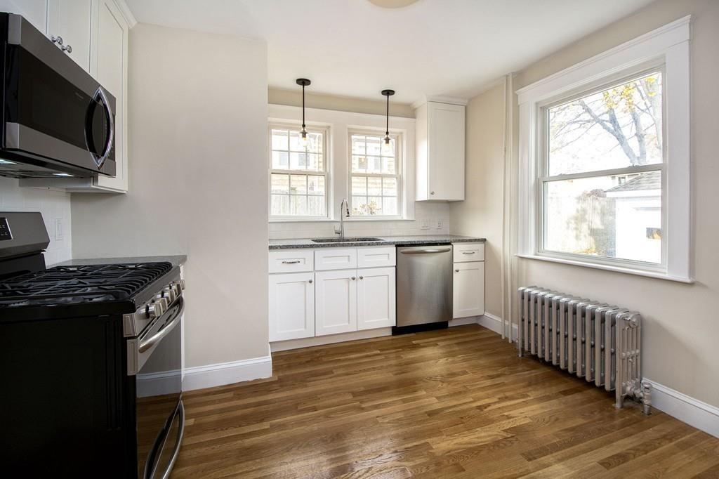20 Bay Ridge Road Scituate, MA 02066 - Photo 14 of 41 a kitchen with stainless steel appliances granite countertop a stove a sink and a microwave