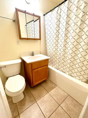 a bathroom with a toilet and a sink
