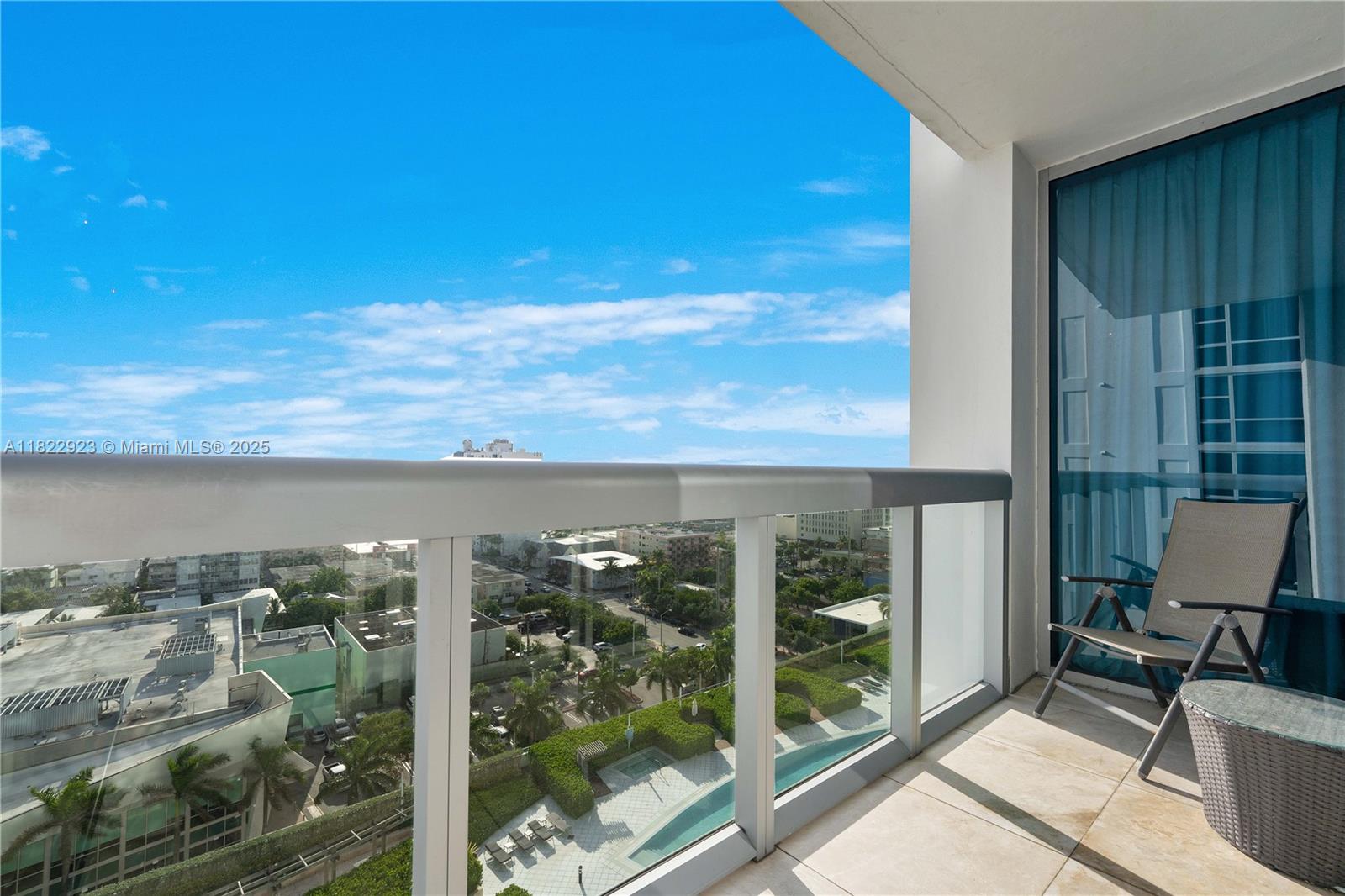 6899 Collins Avenue, Unit 1409 Miami Beach, FL 33141 - Photo 2 of 35 a view of a balcony with chair and table