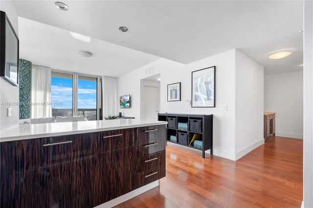 a kitchen with stainless steel appliances wooden cabinets a stove and a microwave