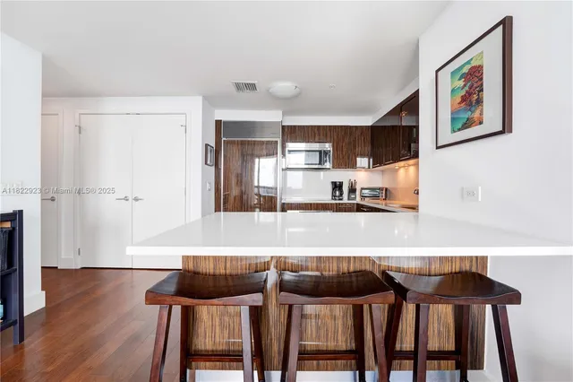 a view of a livingroom with wooden floor