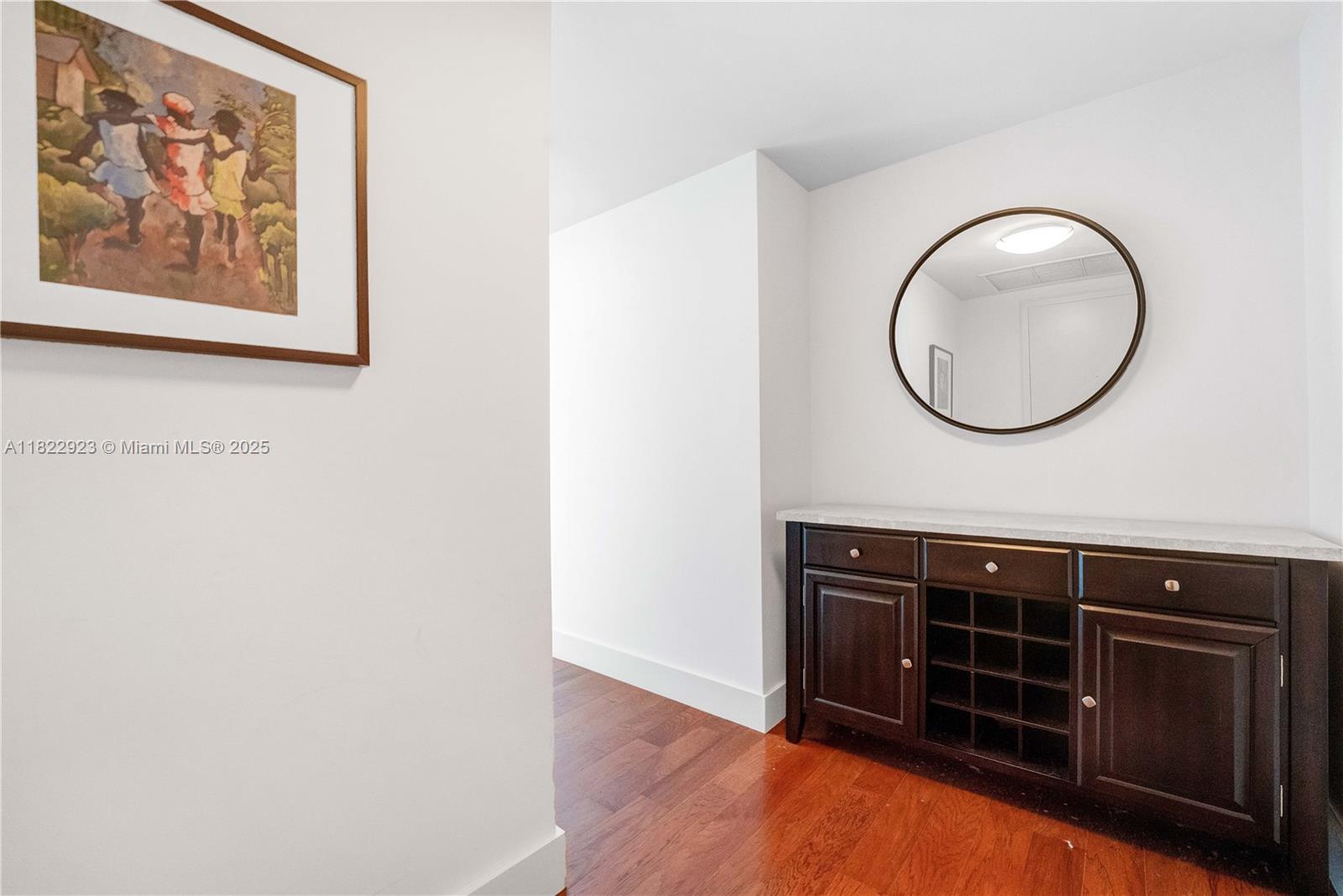 6899 Collins Avenue, Unit 1409 Miami Beach, FL 33141 - Photo 29 of 35 a view of a livingroom with wooden floor