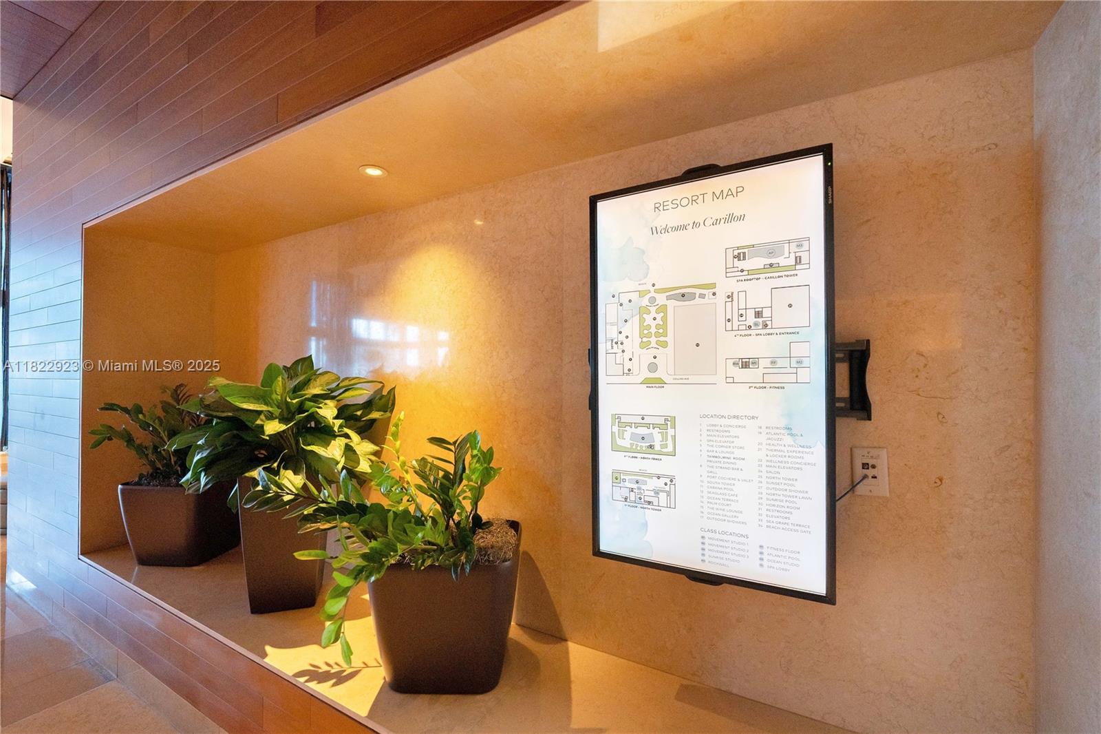 6899 Collins Avenue, Unit 1409 Miami Beach, FL 33141 - Photo 30 of 35 a view of a glass door with the potted plant in front of it