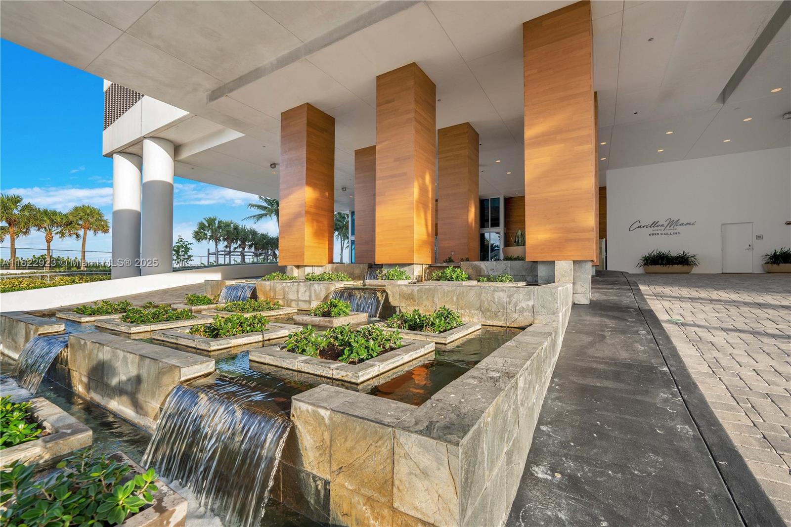 6899 Collins Avenue, Unit 1409 Miami Beach, FL 33141 - Photo 34 of 35 a view of a swimming pool with outdoor seating
