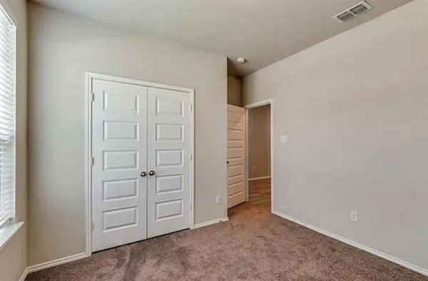 an empty room with closet