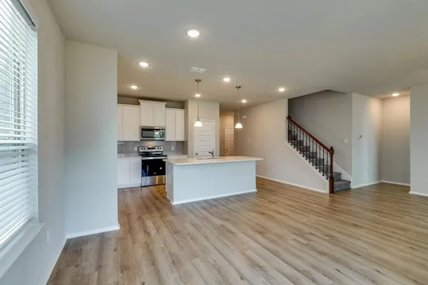 a view of kitchen with microwave and stove