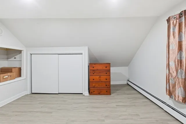 an empty room with a bench