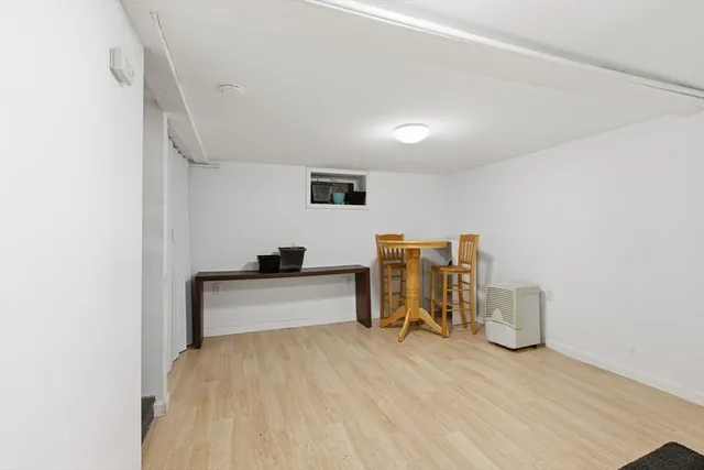 a bedroom with a bed and a chair