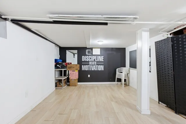 a view of empty room with workspace and window