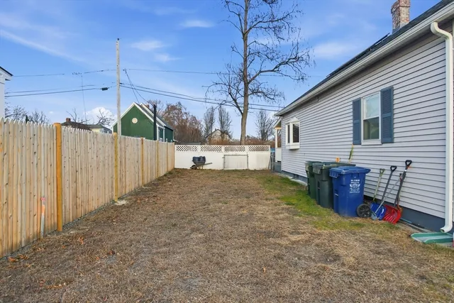 a view of backyard with outdoor seating