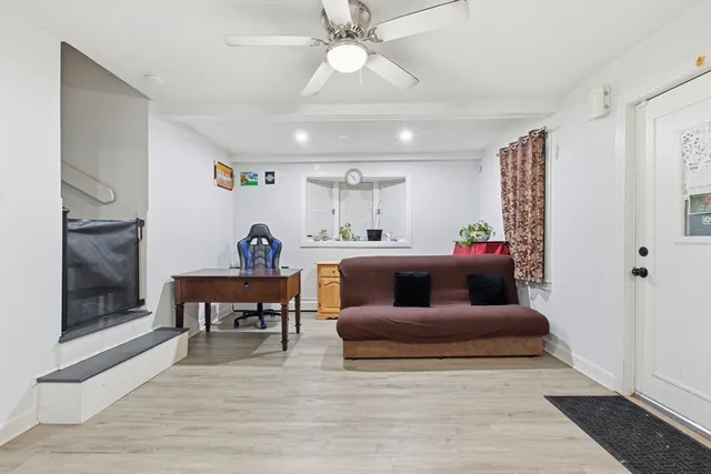 a living room with furniture and a fireplace