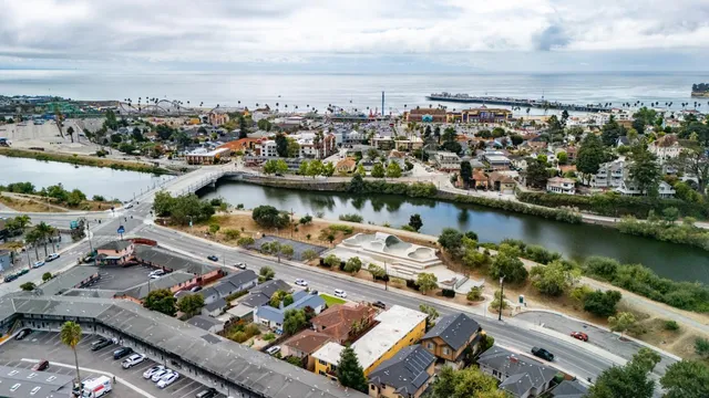 an aerial view of a city with a lake view