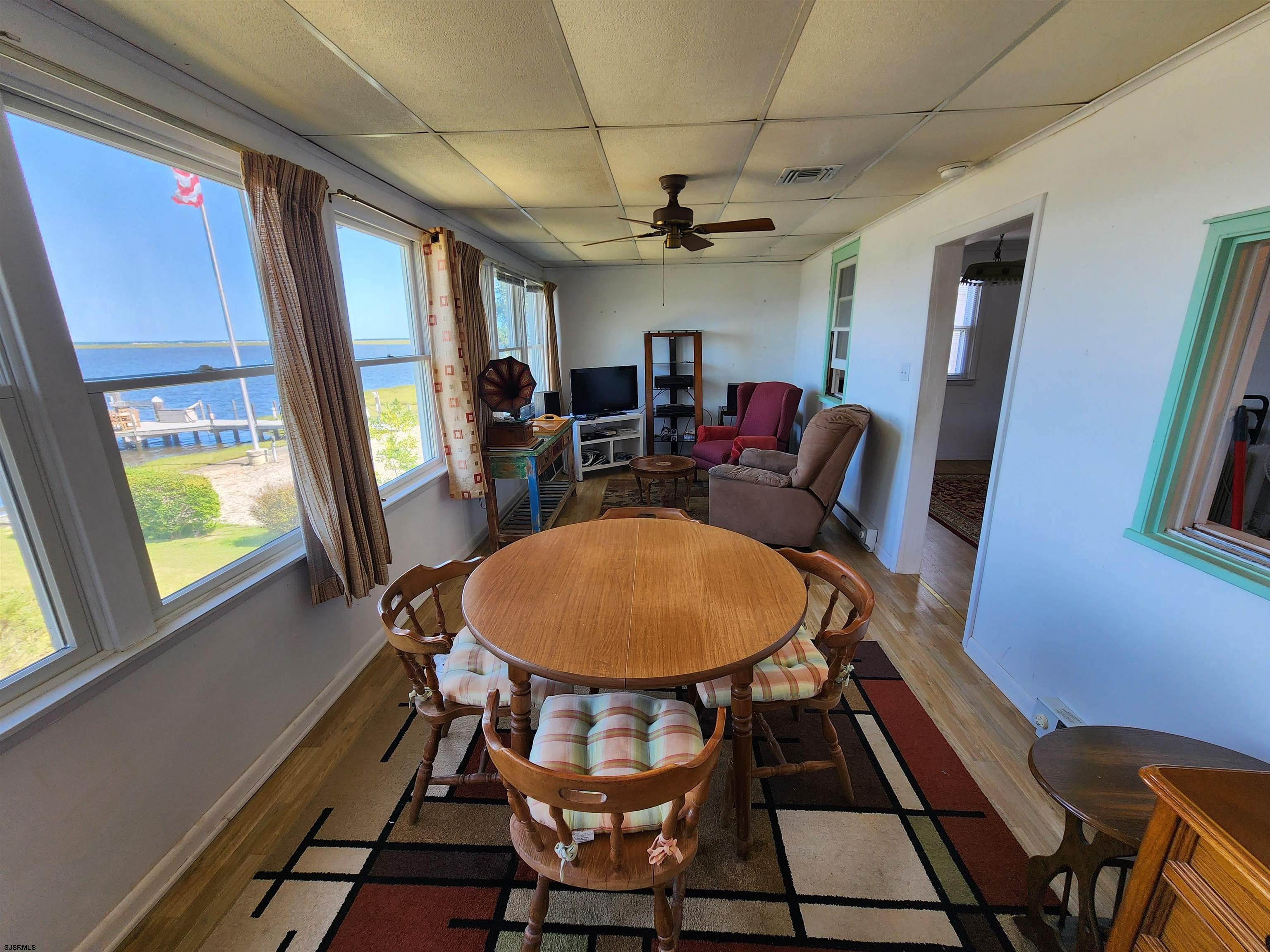 17 River Road Port Republic, NJ 08241 - Photo 11 of 17 a view of a dining room with furniture window and wooden floor