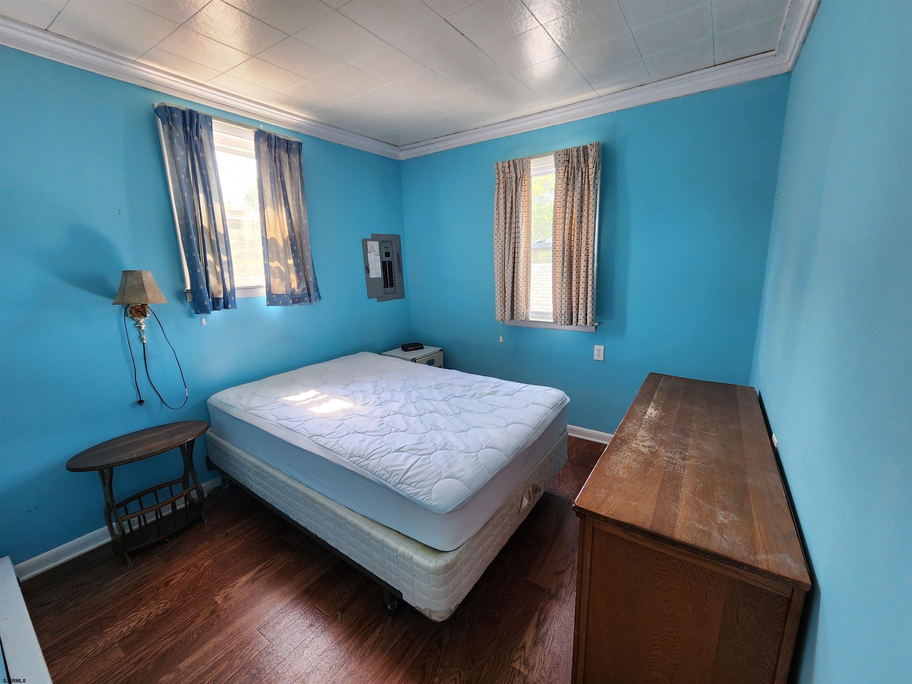 17 River Road Port Republic, NJ 08241 - Photo 13 of 17 a bedroom with a bed and window