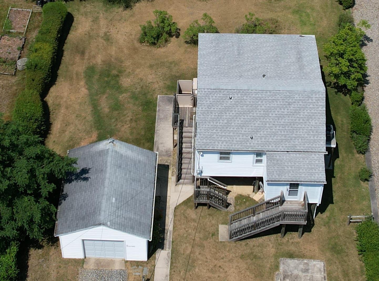 17 River Road Port Republic, NJ 08241 - Photo 3 of 17 an aerial view of a house with couches and wooden floor