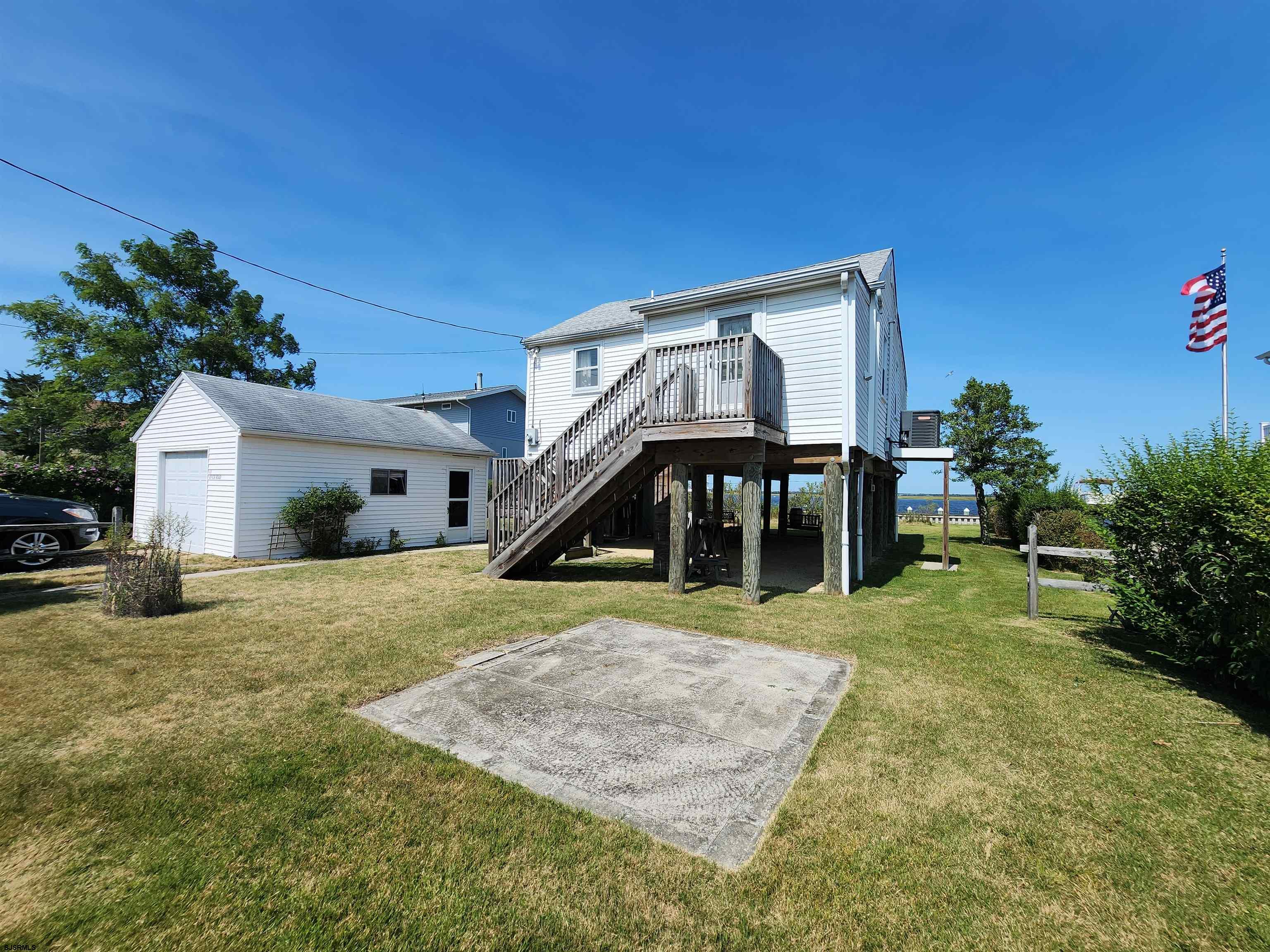 17 River Road Port Republic, NJ 08241 - Photo 4 of 17 a view of a house with backyard and sitting area