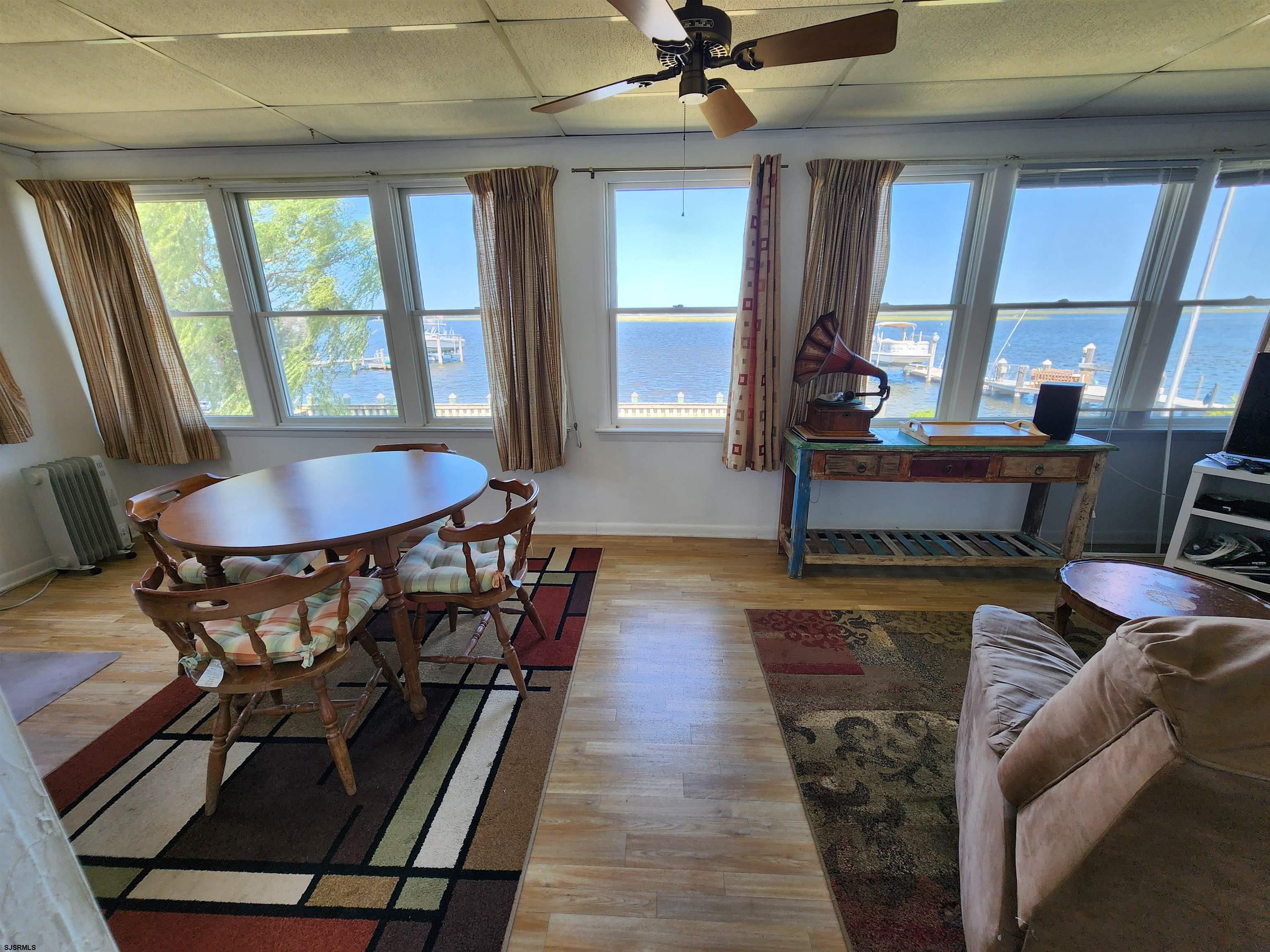 17 River Road Port Republic, NJ 08241 - Photo 9 of 17 a view of a dining room with furniture window and wooden floor