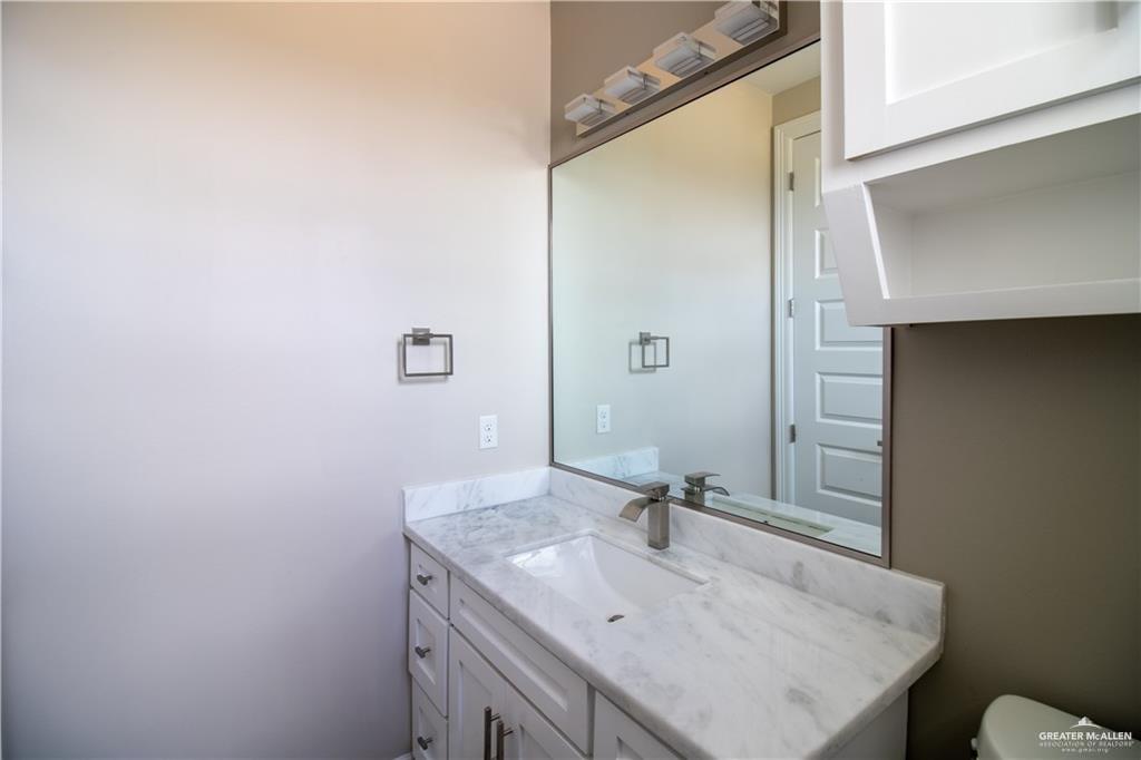 5315 North Crown Point Pharr, TX 78577 - Photo 13 of 30 a bathroom with a sink and a mirror