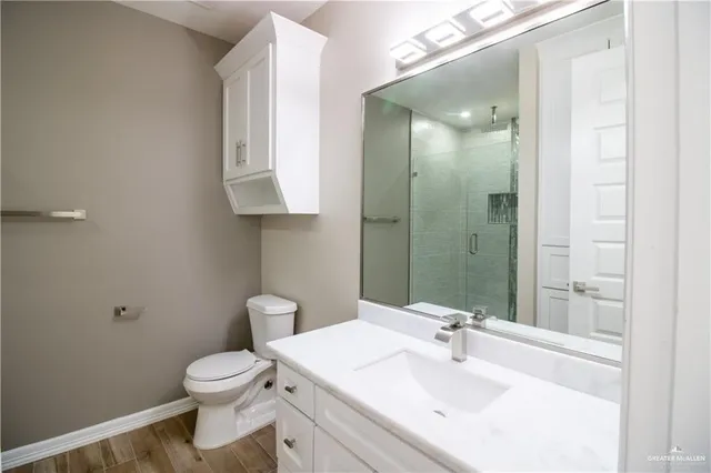 a bathroom with a sink toilet and vanity