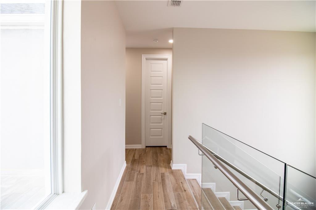 5315 North Crown Point Pharr, TX 78577 - Photo 22 of 30 a view of a hallway with wooden floor