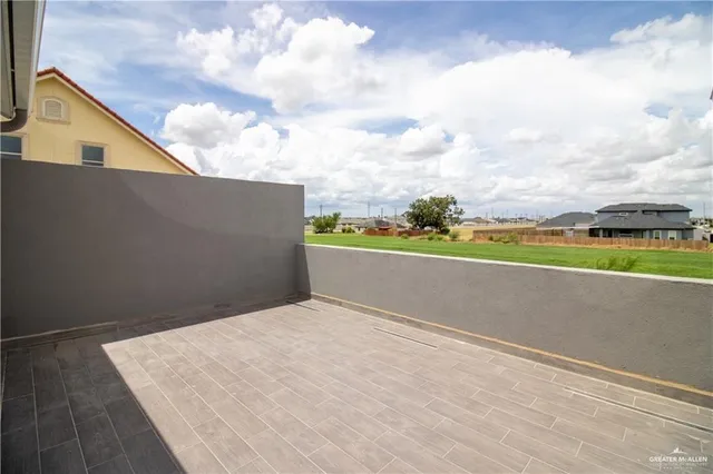 a view of a big room with wooden fence