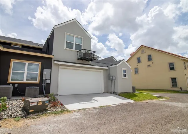 a front view of a house with a garage