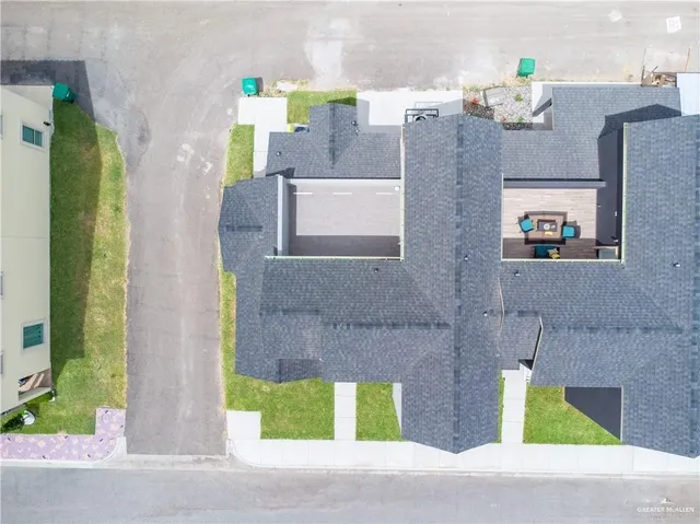 a aerial view of a house with a garden and entryway