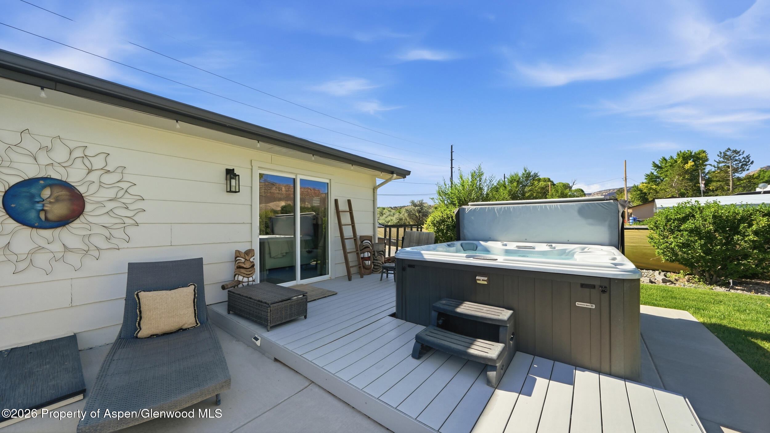 445 South Camp Road Grand Junction, CO 81507 - Photo 28 of 37 a view of a patio with table and chairs with wooden floor and fence
