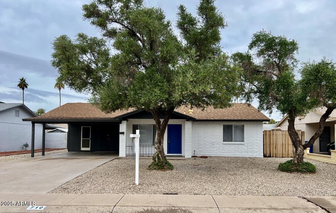 710 East Fordham Drive Tempe, AZ 85283 - Photo 1 of 12 a front view of a house with garden