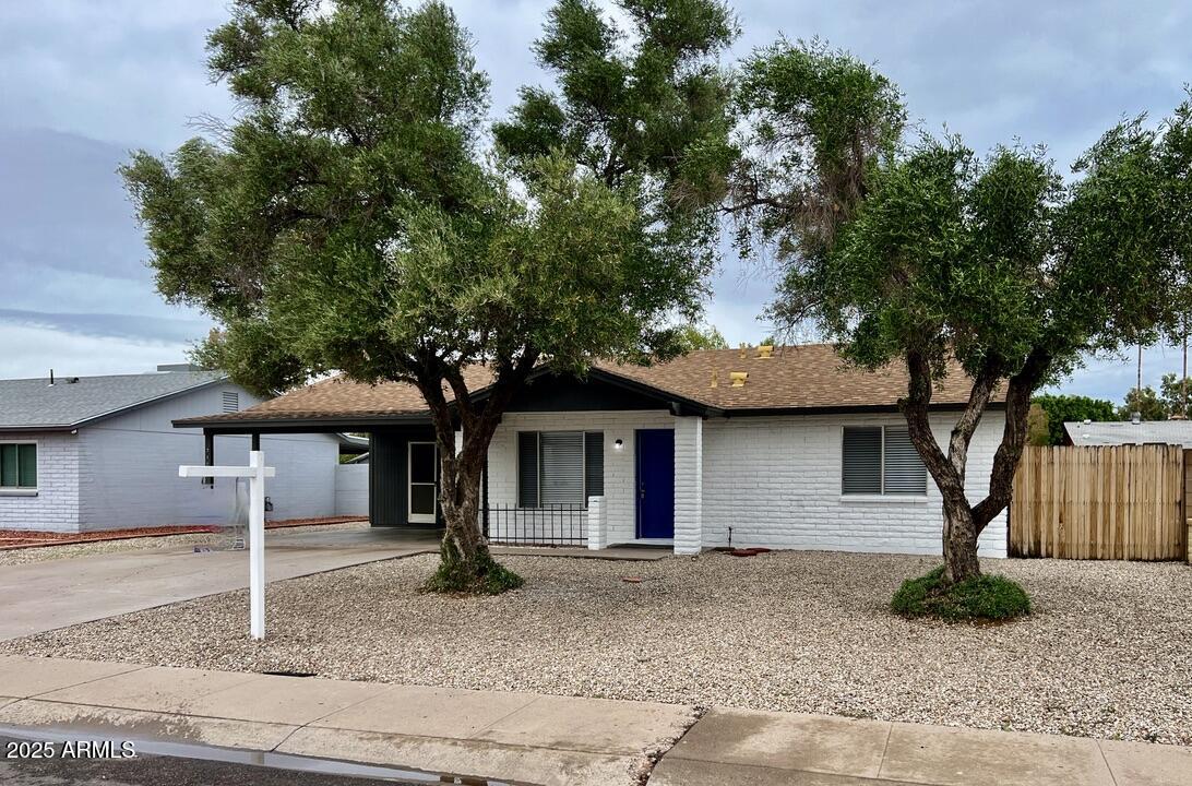 710 East Fordham Drive Tempe, AZ 85283 - Photo 2 of 12 a front view of a house with garden