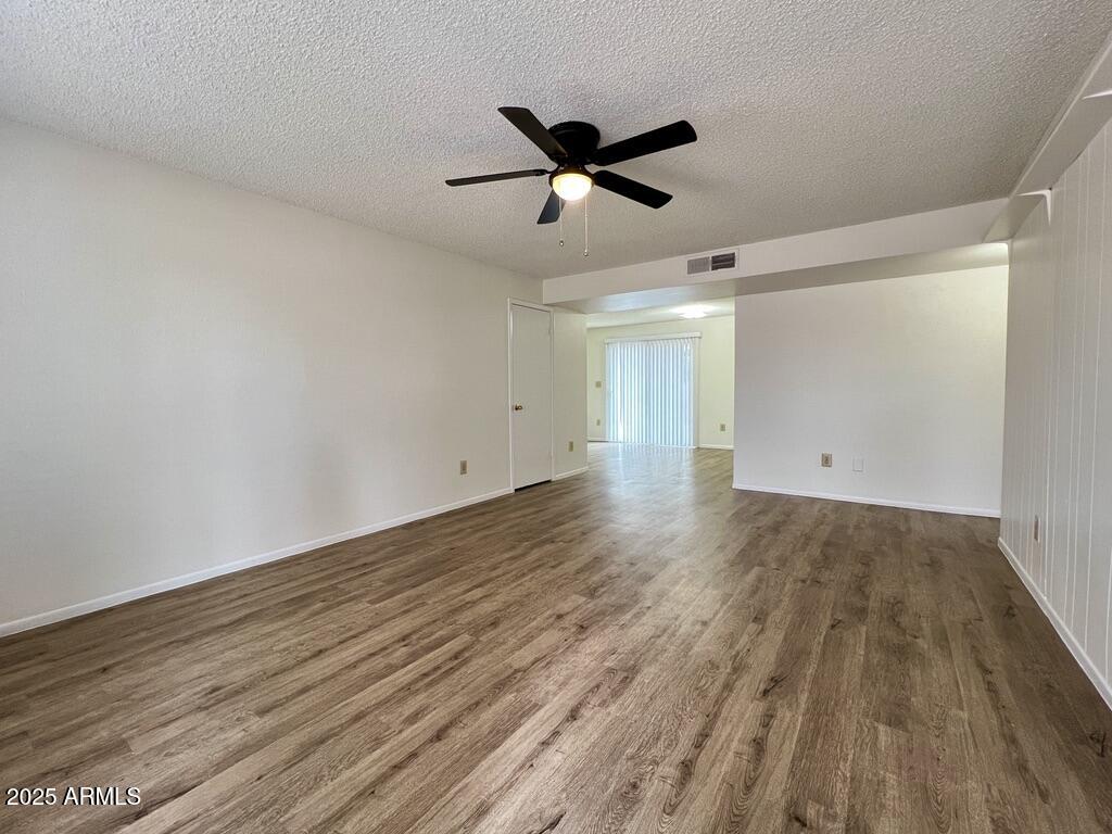 710 East Fordham Drive Tempe, AZ 85283 - Photo 3 of 12 a view of empty room with wooden floor