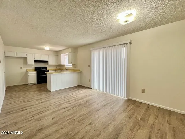 a view of kitchen with wooden floor