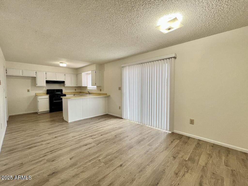710 East Fordham Drive Tempe, AZ 85283 - Photo 5 of 12 a view of kitchen with wooden floor