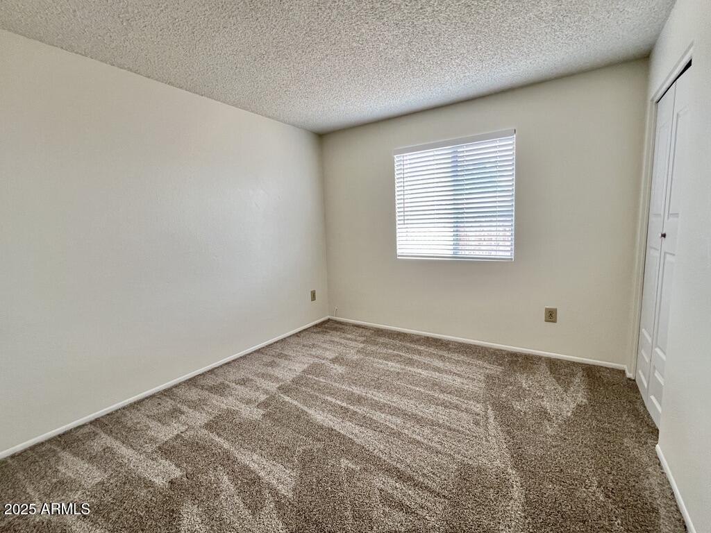 710 East Fordham Drive Tempe, AZ 85283 - Photo 7 of 12 a view of an empty room with a window