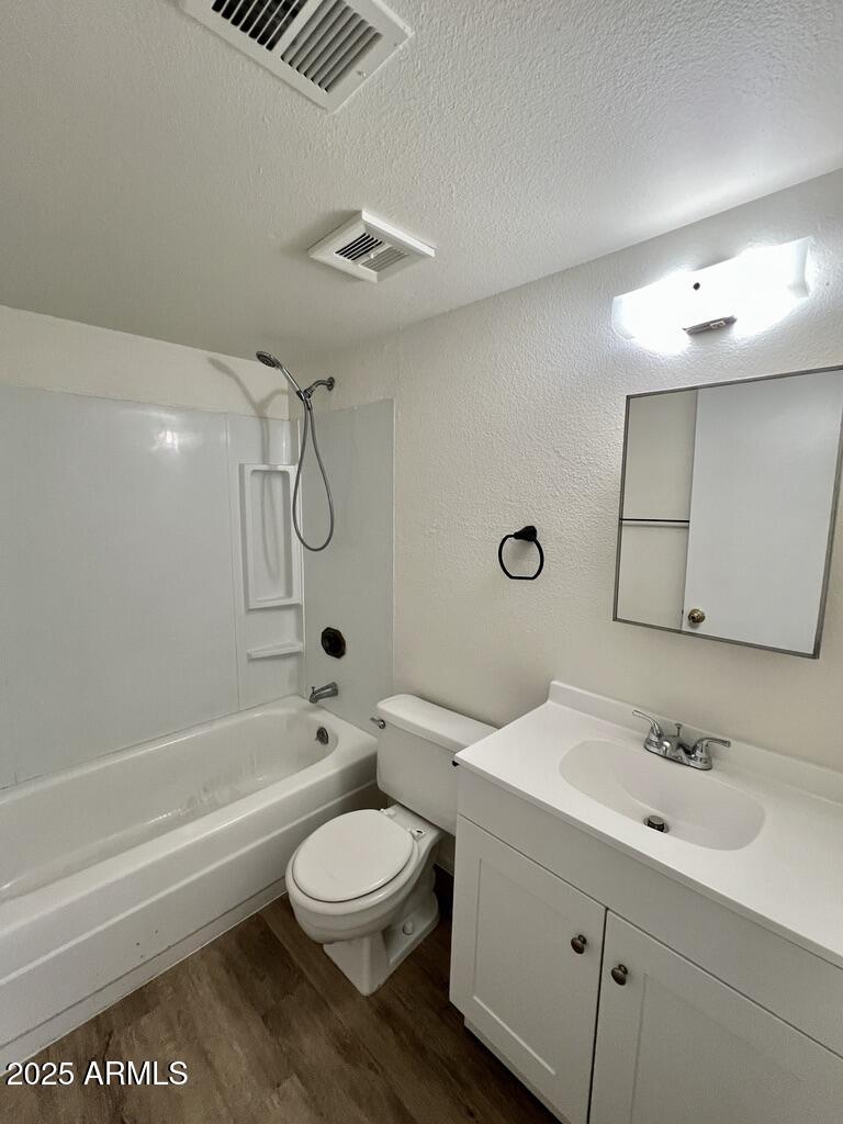 710 East Fordham Drive Tempe, AZ 85283 - Photo 9 of 12 a bathroom with a toilet a sink a mirror and bathtub