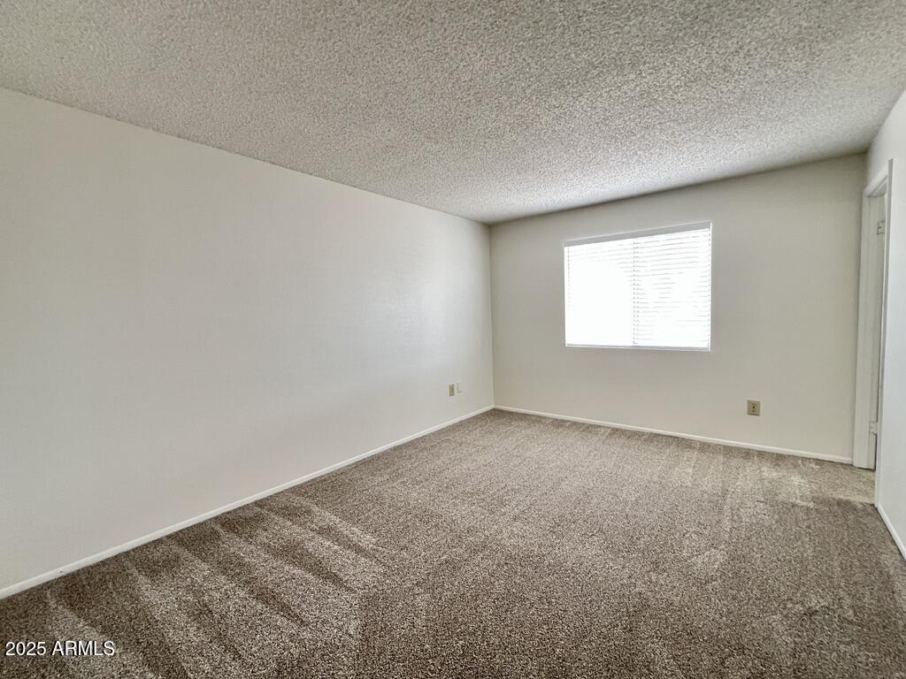 710 East Fordham Drive Tempe, AZ 85283 - Photo 10 of 12 an empty room with a window