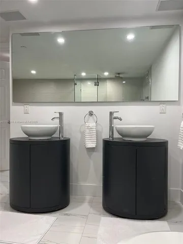 a kitchen with a refrigerator and a sink