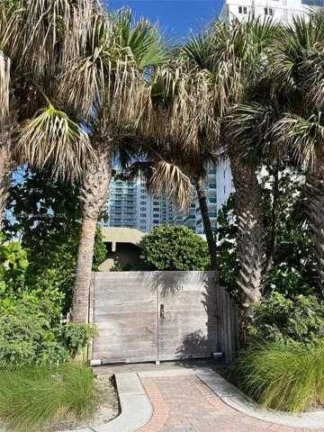 a view of multiple houses with yard