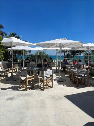 a kitchen with stainless steel appliances granite countertop a sink and wooden cabinets