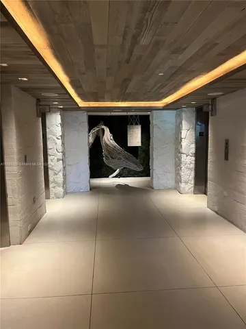 a view of a chair and table in backyard