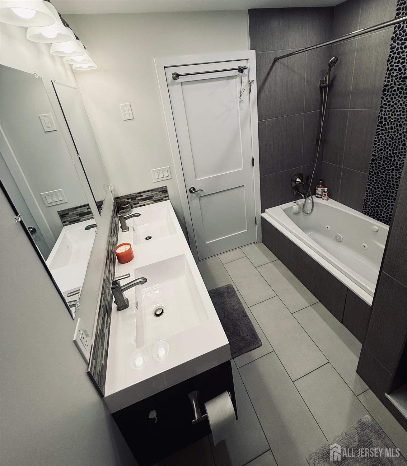 566 Ticetown Road Old Bridge, NJ 08857 - Photo 17 of 23 a bathroom with a sink vanity and tub
