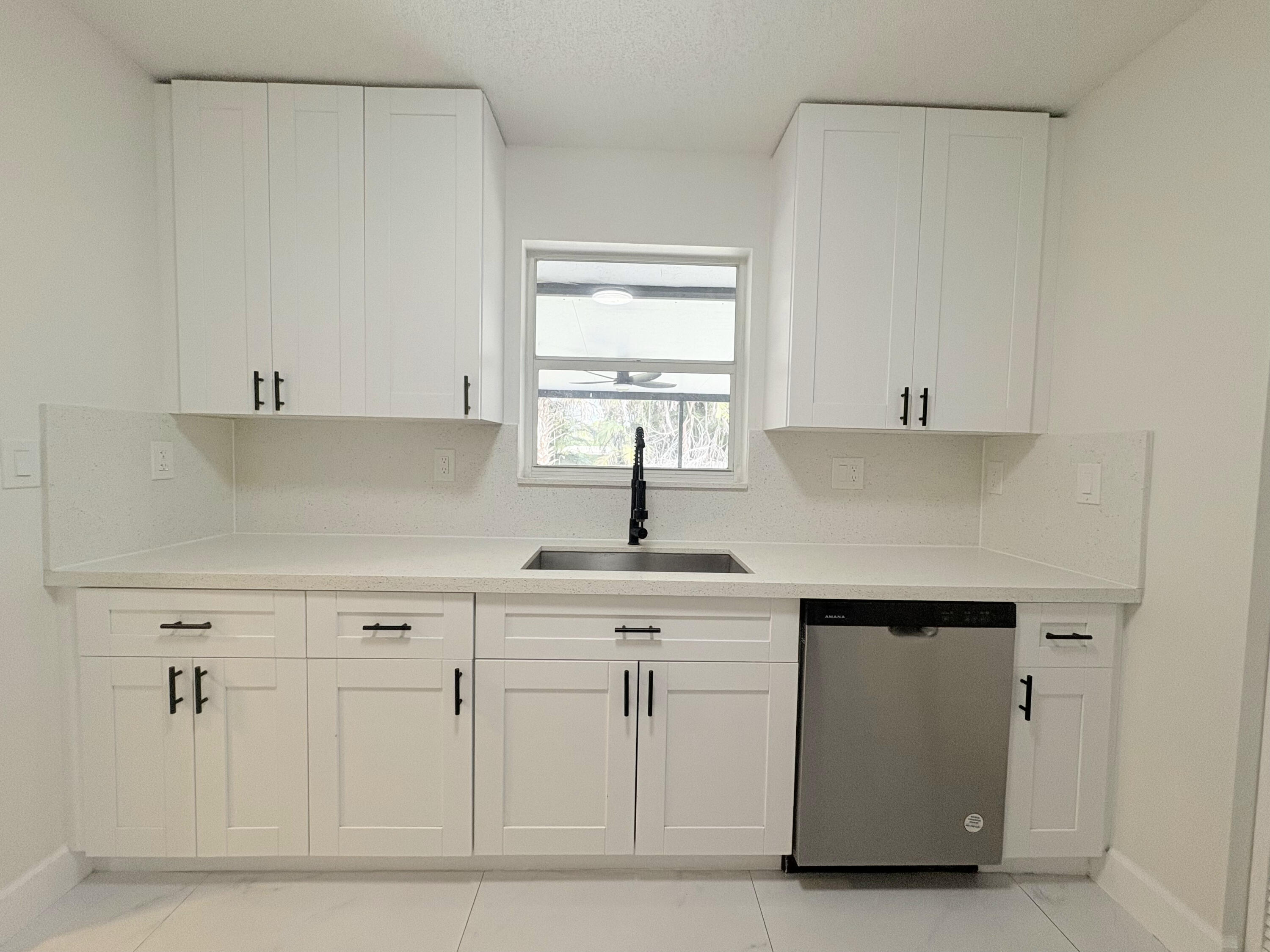14523 Flamingo Road Loxahatchee Groves, FL 33470 - Photo 37 of 50 a kitchen with white cabinets