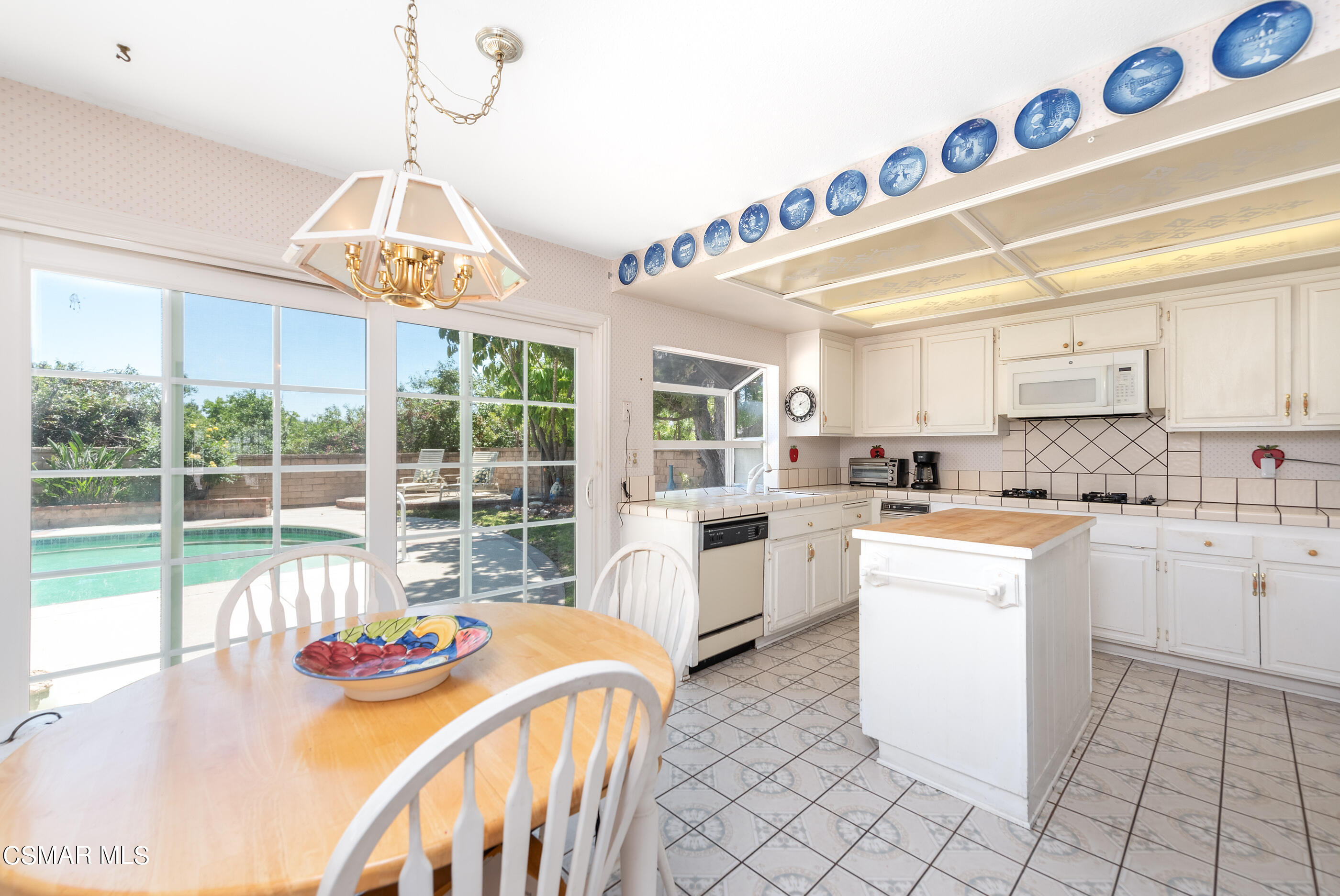 4230 Roxbury Street Simi Valley, CA 93063 - Photo 12 of 40 a kitchen that has a lot of cabinets in it